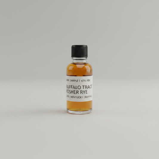 Small bottle of Buffalo Trace Rye whiskey on a white surface with a gray textured background