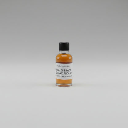 Small bottle of Buffalo Trace whiskey sample with a label on a beige background