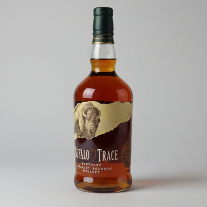 Bottle of Buffalo Trace bourbon whiskey on a bar counter with a blurred background