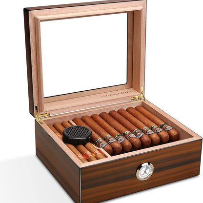 Wooden humidor with glass top containing cigars and a humidifier on a white background