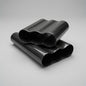 Two rolled sheets of glossy black carbon fiber wrap with a wavy pattern, displayed on a neutral light gray background.