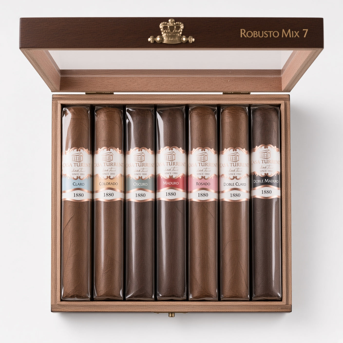 An open wooden humidor box labeled 'Robusto Mix 7' containing seven wrapped cigars in a clean studio shot on a white background.