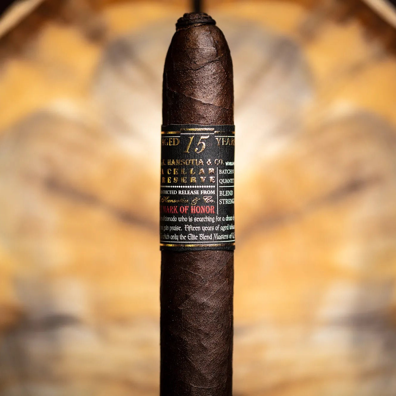 Cigar with label against a blurred natural background
