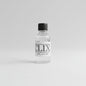 Small bottle labeled 'CLIX' on a bar counter with a blurred background