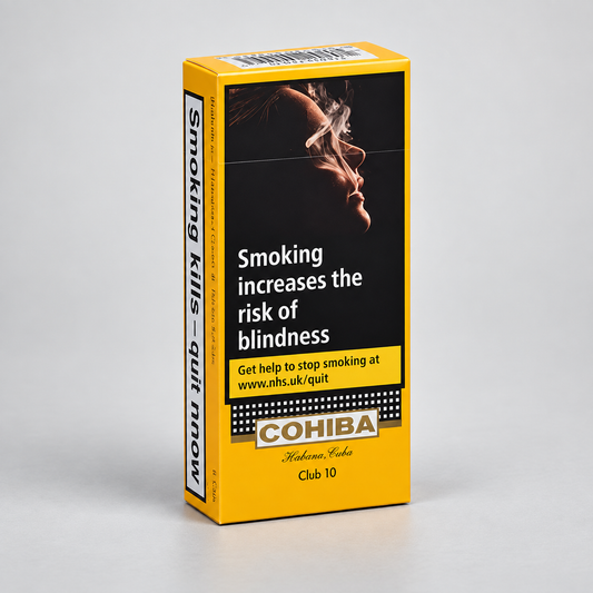 A Cohiba Club 10 cigarette pack box standing upright on a light gray studio background. The packaging is bright yellow with a large black warning panel showing a smoking figure and text about blindness risk, plus the Cohiba brand name near the bottom.