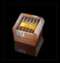 A Cohiba 25 Siglo I wooden cigar humidor box containing several brown cigars with gold bands, shown on a black reflective background.
