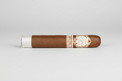 A single brown cigar shown horizontally against a white background, with a white paper band at one end and a decorative gold, red, and white label on the other.