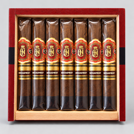 Eight cigars in clear plastic sleeves with red, gold, and black labels reading 'BROADWAY' and a large 'BA' logo, arranged inside an open reddish-brown wooden presentation box on a light gray background.