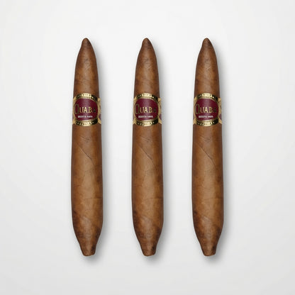 Three brown cigars with gold and burgundy bands labeled 'Cuaba.