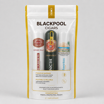 A stand-up pouch of Blackpool Cigars humidors and accessories, featuring three individual humidors inside: a red and white 'Hombre No. 3' humididor, a black and gold 'Donation' humididor, and a white 'Favoritos' humididor.