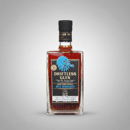 Driftless Glen Rye Whiskey bottle with label and black cap on a white background