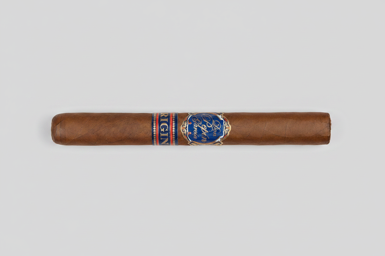 A single brown cigar with a blue and red band featuring the Escobar brand logo.