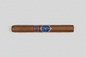 A single brown cigar with a blue and red band featuring the Escobar brand logo.
