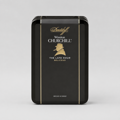 A black rectangular metal tin of Davidoff Winston Churchill The Late Hour Belicoso, featuring gold lettering and a gold silhouette of Winston Churchill, set against a light gray background.