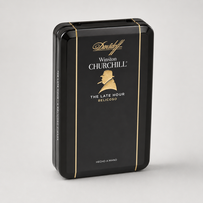 A black rectangular metal tin package for Winston Churchill The Late Hour Belicoso, featuring gold lettering and a gold silhouette of Winston Churchill on the front, set against a light gray background.