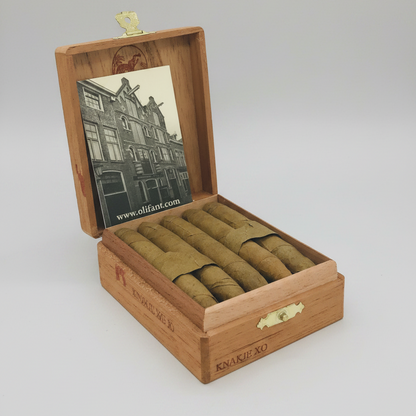 Wooden humidor with cigars and a vintage-style photo on a white background