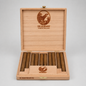 An open wooden cigar box on a light gray background, containing ten brown cigars. The box is made of light natural wood with engraved branding for De Olifant, including a bird logo and the text 'KAMPION HOLLAND' on the inner lid, and 'SCHEEPSKISTJE' on the front panel.