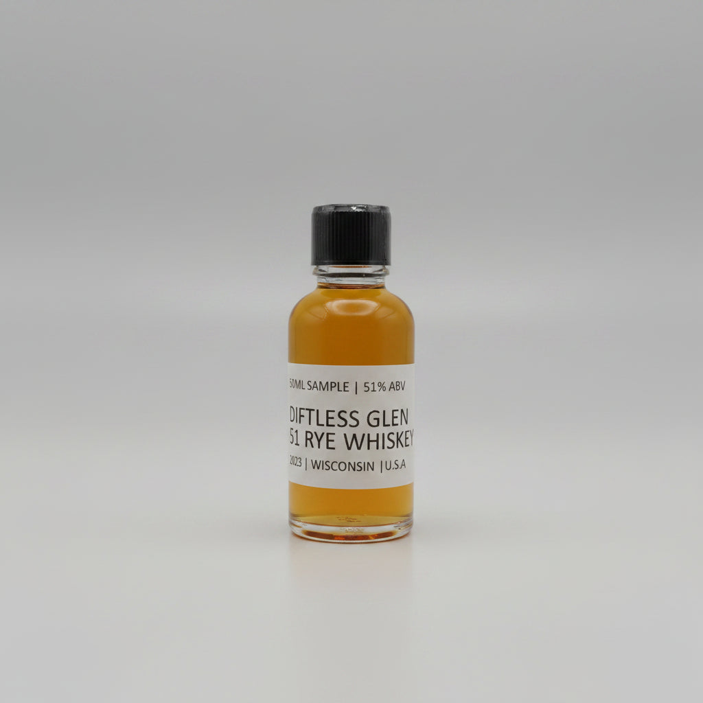 Small bottle of Diftless Glen Rye Whiskey with a black cap on a white background