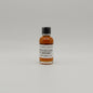Small bottle of Diftless glen Whiskey on a light gray background