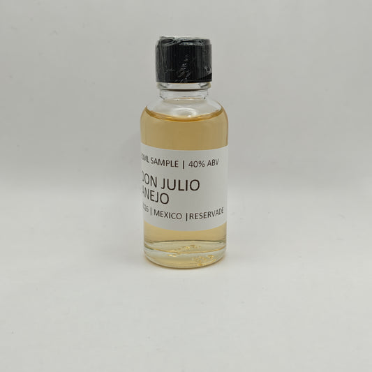 Small bottle of Don Julio Anejo on a gray background