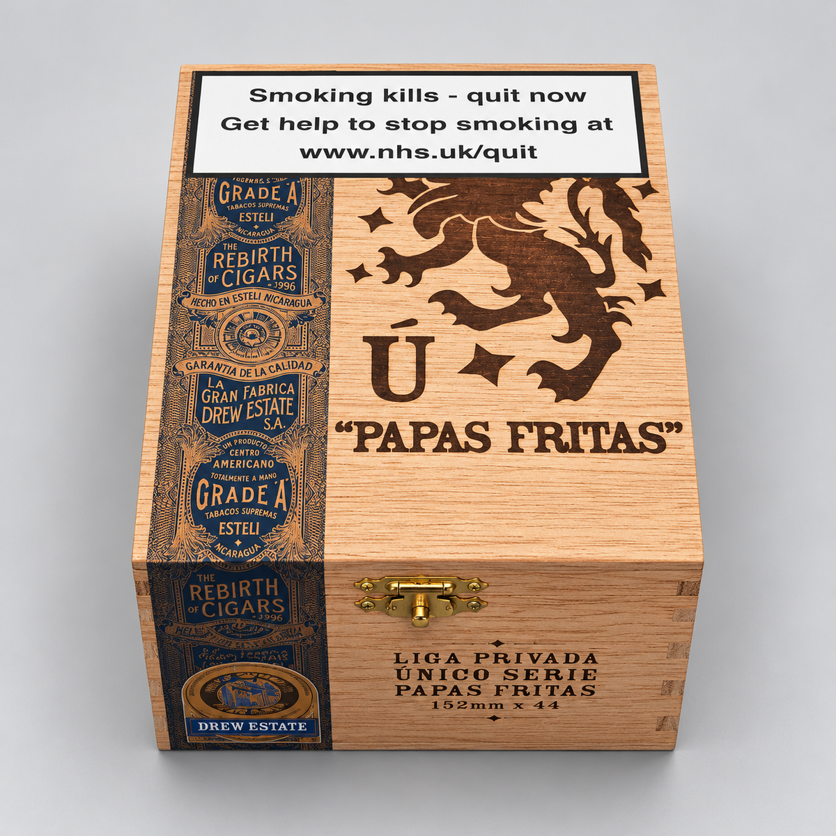 A wooden cigar box labeled 'Papas Fritas' with a prominent smoking-health warning on the top panel and dark engraved branding, shown on a light gray background.