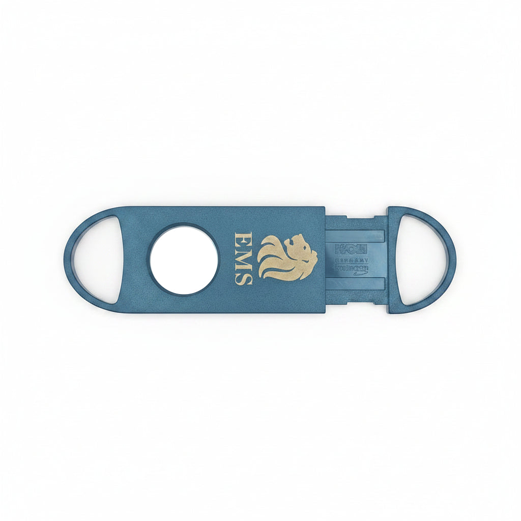 A black cigar cutter, a lion emblem, and the text 'EMS' on a neutral gray background.