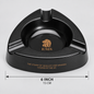 Black triangular cigar ashtray with gold EMS lion logo and text, shown on a light gray background with a 6-inch (15 cm) width measurement overlay.
