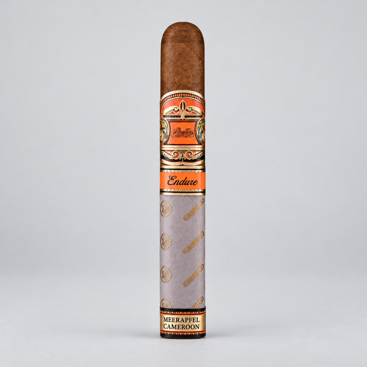 A single cigar in its paper sleeve, standing upright against a light gray background. The cigar is labeled 'Endure' and 'Meerappel Cameroon'.