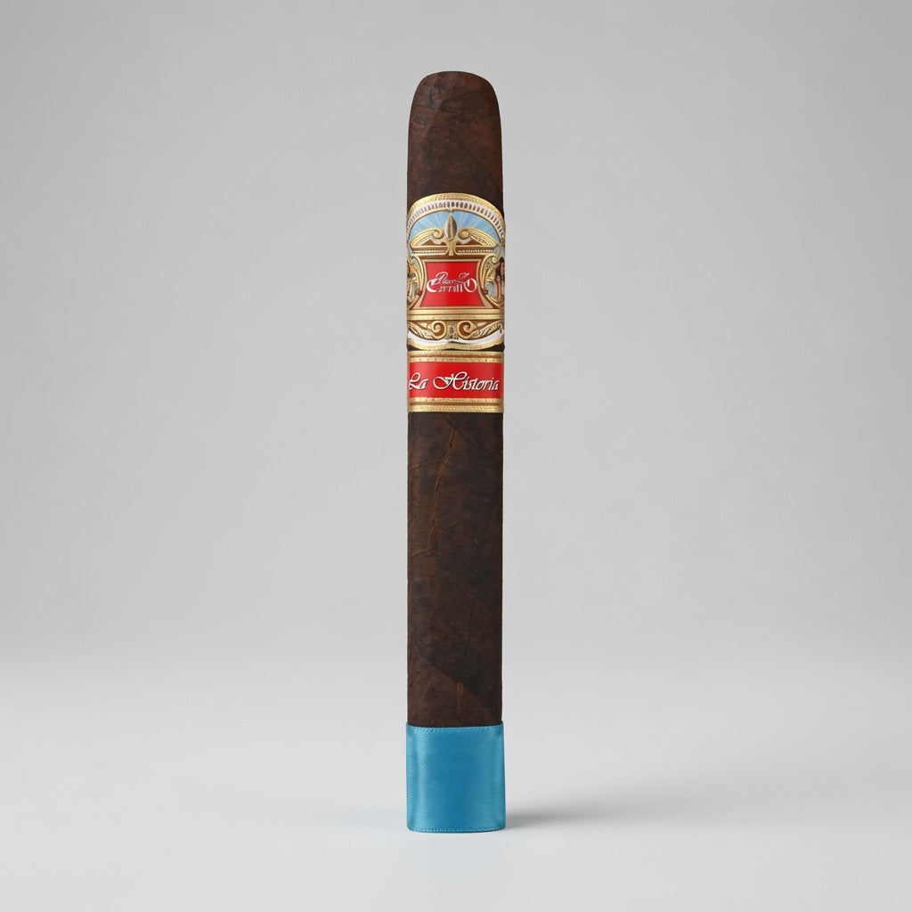 A single dark brown cigar standing upright on a light gray background, featuring a decorative red, gold, and blue band and a bright blue tip.