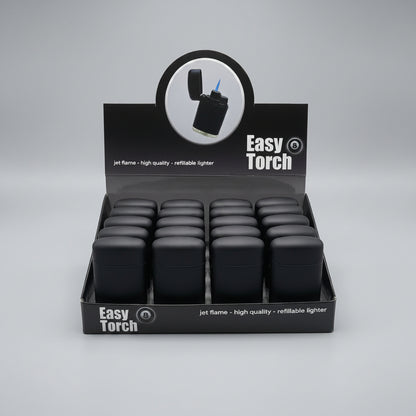 A retail display box filled with black jet flame refillable lighters, branded Easy Torch, on a neutral gray background.