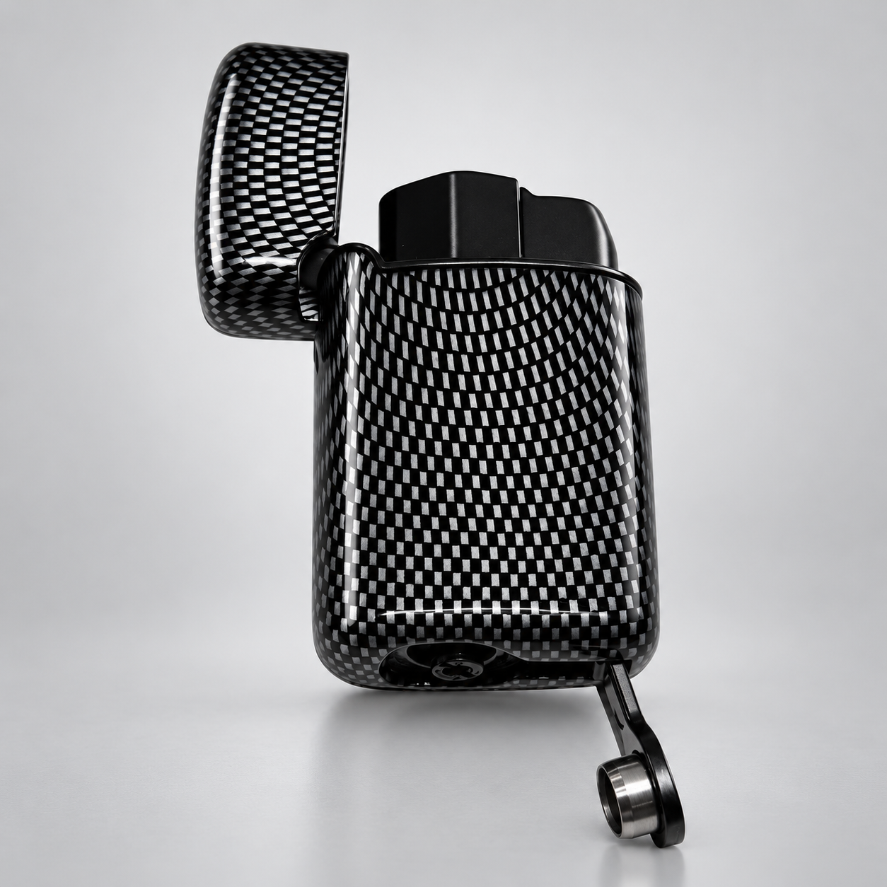 A carbon fiber patterned lighter with its lid open, showing a glossy black and white woven texture, set against a clean light gray background.