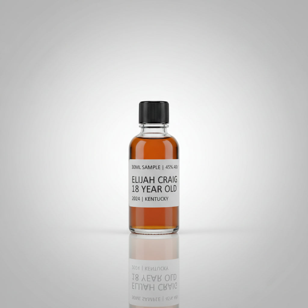 Bottle of Elijah Craig 18 Year Old bourbon on a reflective surface with blurred background
