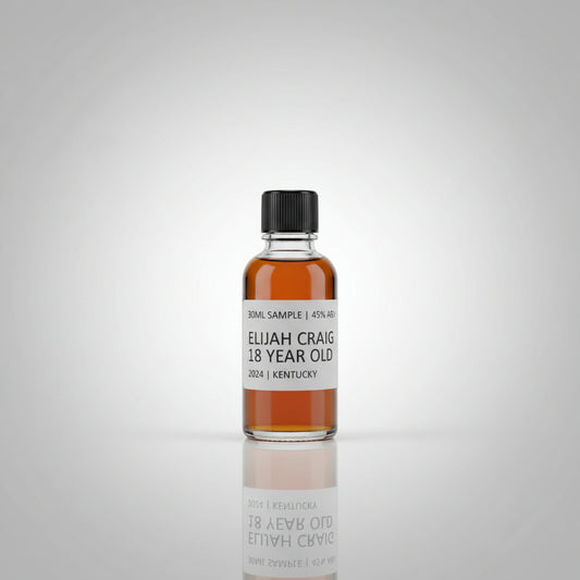 Bottle of Elijah Craig 18 Year Old bourbon on a reflective surface with blurred background