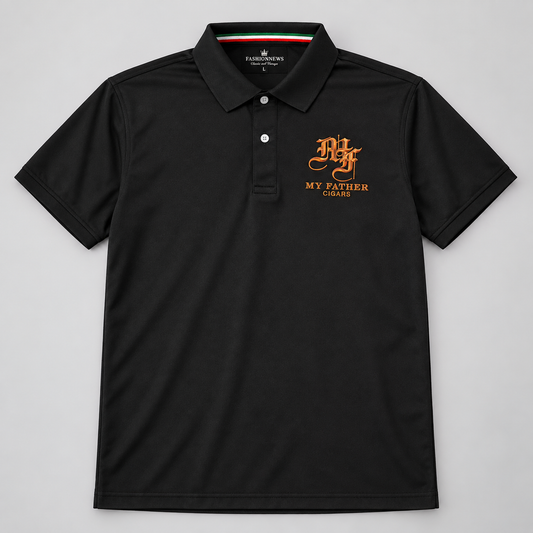 A black short-sleeve polo shirt with a two-button placket and a small orange embroidered logo on the left chest reading 'My Father Coaches'. The inside collar features a small Italian flag detail.