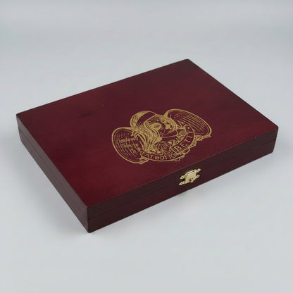 A rectangular dark red wooden presentation box with a gold engraved illustration of a winged skull and the text 'Viva BF 101' on the lid, photographed on a light gray background.