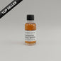 Small bottle of Four Roses Single Barrel whiskey on a beige background