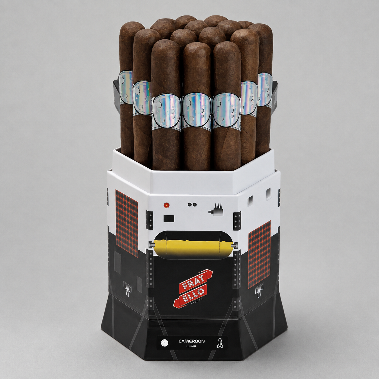 A novelty cigar humidor container designed to look like a sci-fi spaceship cockpit, holding a full load of dark brown cigars with silver bands. The container features a white top section, a black lower section, and red grid details, with a red 'FRAI ELLO' logo on the front.