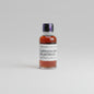 Bottle of Garrison Brothers Balmorhea whiskey on a reflective surface with blurred background