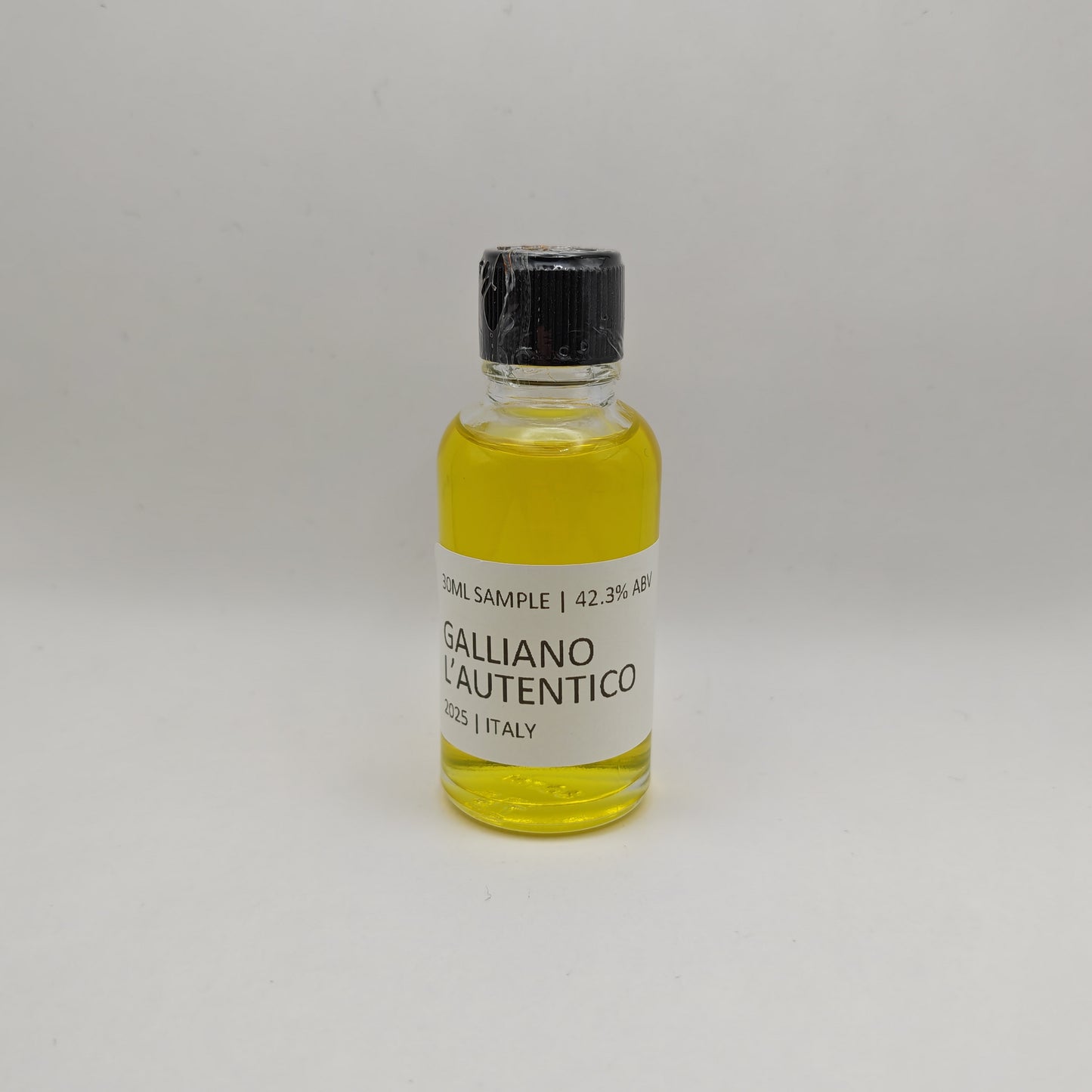 Small bottle of Galliano L'Autentico on a white background