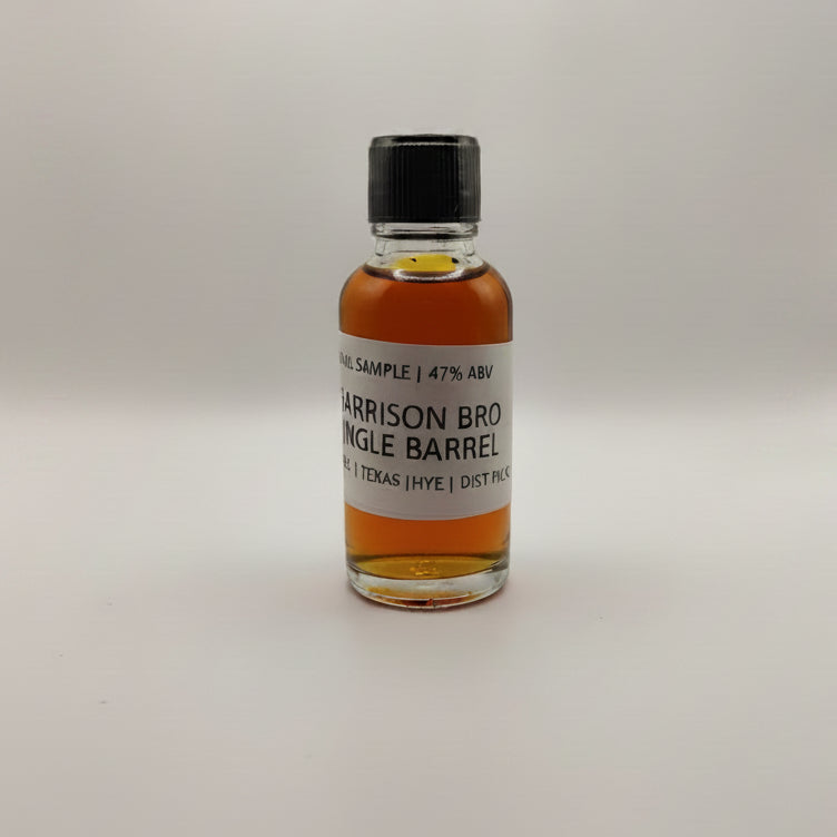 Small bottle of Garrison Bros Single Barrel whiskey on a white surface