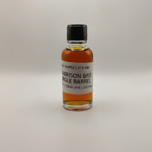 Small bottle of Garrison Bros Single Barrel whiskey on a white surface
