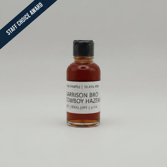 Bottle of Garrison Brothers Cowboy Hazemat Whiskey on a white background