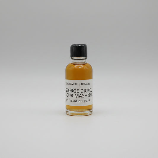 Small bottle of George Dickel Rye Whiskey sample on a white background