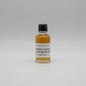 Small bottle of George Dickel Rye Whiskey sample on a white background