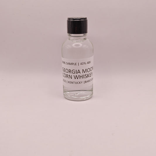 Small bottle of Georgia Moon Corn Whiskey on a light gray background