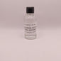 Small bottle of Georgia Moon Corn Whiskey on a light gray background