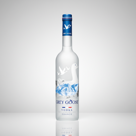 Grey Goose vodka bottle with blue label and mountain design