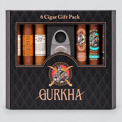 A black Gurkha 6 Cigar Gift Pack box containing six cigars and a silver cigar cutter, shown on a light gray background.