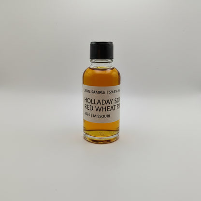 Small bottle of Holladay Red Wheat Whiskey on a white background