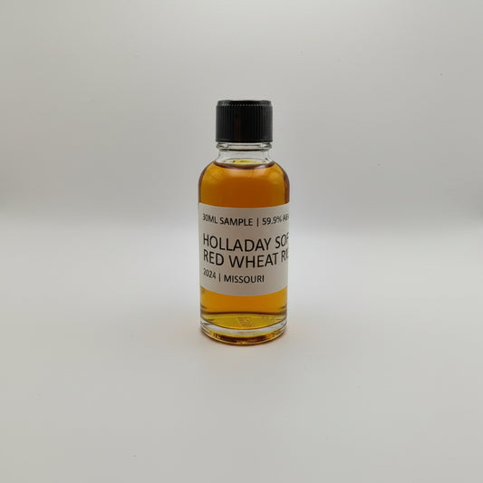 Small bottle of Holladay Red Wheat Whiskey on a white background